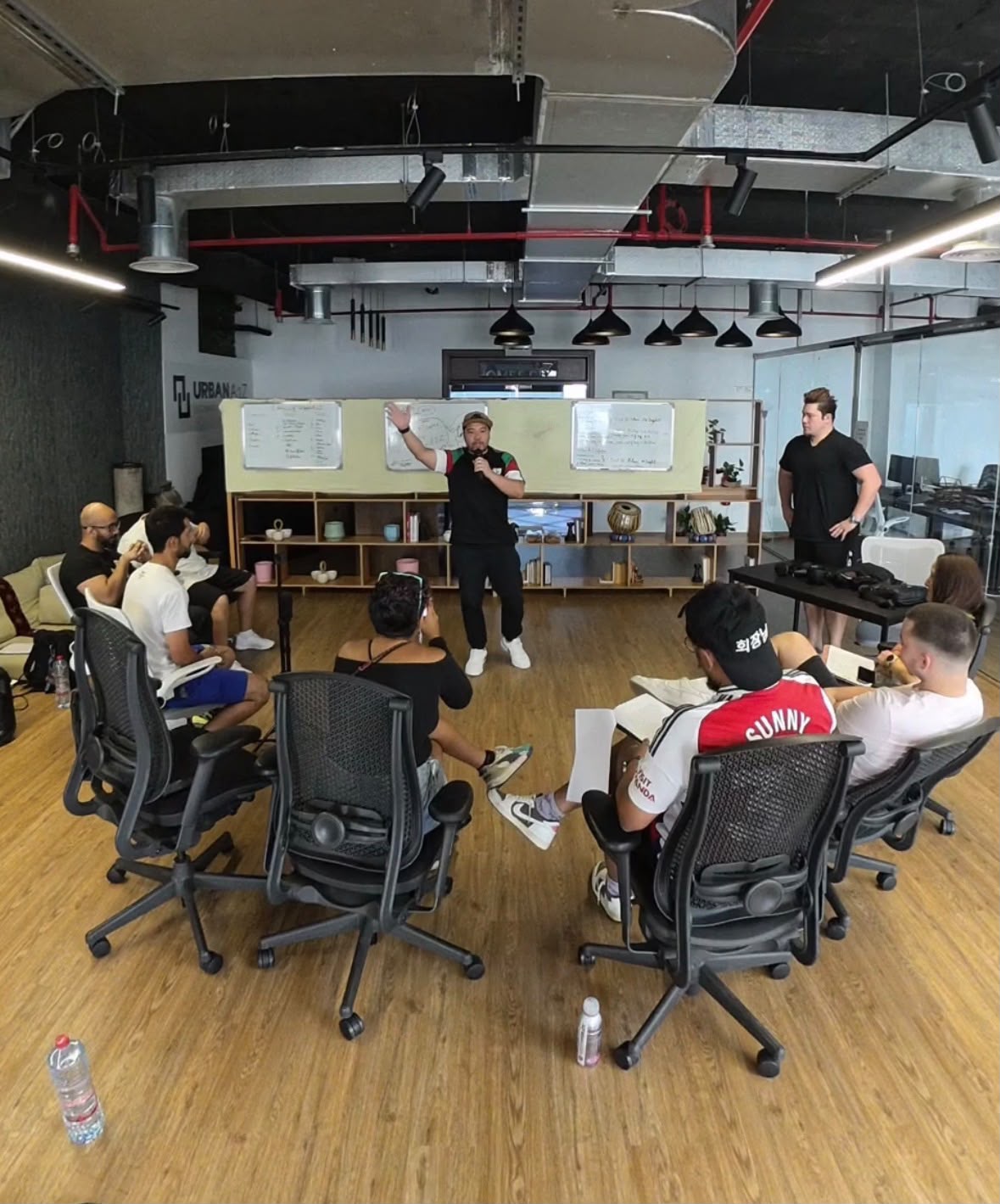 Presenter speaking in front of the team