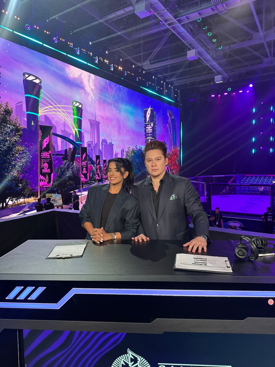 Steve Moore and a woman announcer at a live event